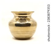 a clean golden indian brass vessel used as a water pot for traditional rituals during religious hindu festivals isolated in a white background