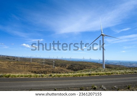 Clean green energy generation, wind turbines on an industrial wind farm in the dry shrub steppe climate of central Washington state
