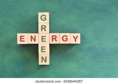 Clean and green energy problem solving, solution and strategy concept. Crossword flat lay composition in green background. 