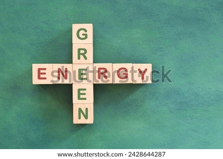 Clean and green energy problem solving, solution and strategy concept. Crossword flat lay composition in green background. 