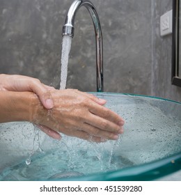 Clean hands by washing hands with soap 