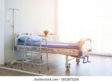 Clean and hospitality of room with empty bed and medical equipment in hospital.