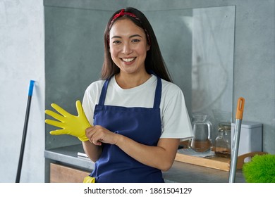 For A Clean House. Portrait Of Joyful Young Woman, Cleaning Lady Smiling At Camera, Wearing Protective Glove While Getting Ready For Cleaning The House