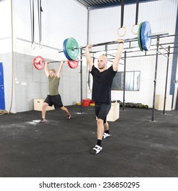Clean And Jerk Workout At Fitness Gym Center