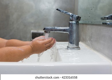 Clean Kid Hands By Washing Hands With Soap