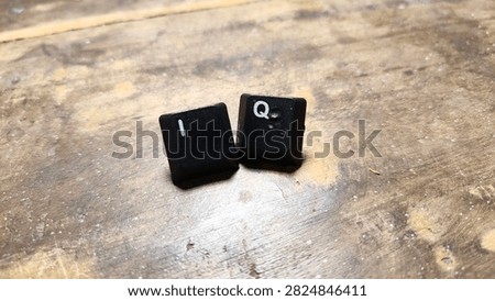 A clean macro shot capturing a sequence of mechanical computer keys neatly lined up on a dark brown wooden desktop. The sharp focus emphasizes the fine plastic texture and standard labeling of the keycaps against the natural wood background. Perfect for hardware review articles, coding tutorials, and desktop workspace inspiration blogs. The balanced lighting casts subtle shadows, adding depth and realism to the composition, making it a reliable visual choice for tech enthusiasts and graphic designers seeking authentic computer hardware imagery. This detailed photograph provides high-resolution quality suitable for commercial web applications, digital publishing layouts, and modern office productivity guides focused on tech accessories.