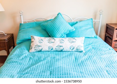 Clean Made Bed Linen With Headboard Nightstand Table And Lamp With Vintage Beach Theme Decorative Blue Pillows In Bedroom In Home House