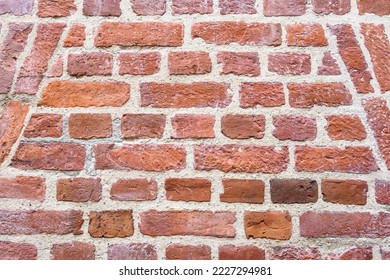 Clean Masonry Work In An Old Brick Wall, As A Patterned And Weathered Background
