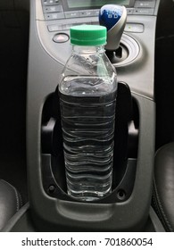 Clean Mineral Water Bottle In The Car Dashboard Cup Holder