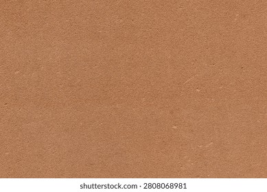 Clean, minimalist architectural backdrop featuring an exterior wall finished with mineral stucco plaster. Fine-grain sanded aggregate surface providing maximum legibility for text overlays.