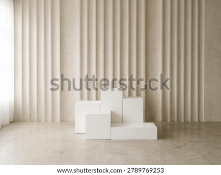 A clean, minimalist studio scene featuring white geometric blocks arranged as pedestals against a backdrop of soft, neutral curtains.