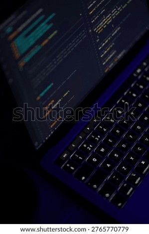 A clean and modern developer workspace featuring a laptop with coding screen in dark mode. Ideal for concepts like web development, programming, freelancing, and remote work.