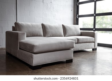 Clean modern interior design elements with full sectional couch
