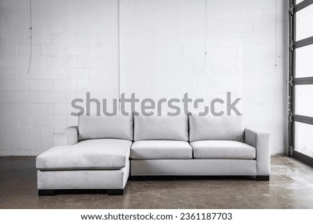 Clean modern interior design elements with sectional sofa