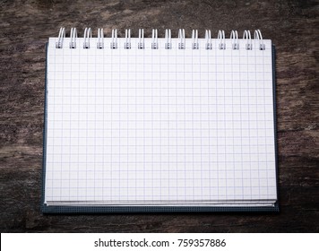 clean notebook on a wooden table