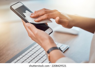 Clean, office and woman hands cleaning phone screen with wet wipes for hygiene, cleaniness and disinfection of bacteria, virus or coronavirus. Closeup female hands wiping smartphone at office desk - Powered by Shutterstock