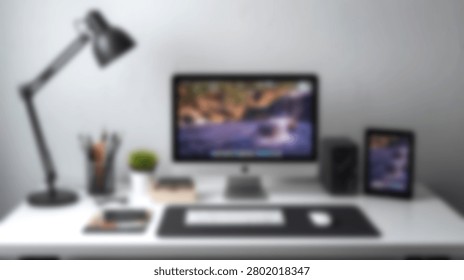 A clean organized workspace featuring a desktop computer keyboard mouse lamp and tablet on a white desk