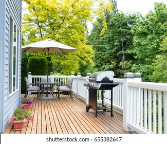 Clean Outdoor Cedar Wooden Deck And Patio Of Home During Daytime 