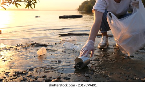 Clean up plastic on the beach. Plastic pollution and environmental problem concept. Voluntary volunteer cleaning of nature from plastic. Greening the planet. No plastic whatsoever.