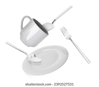 Clean plate, cup and cutlery falling on white background - Powered by Shutterstock