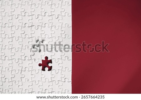 Clean puzzle elements on the background. Empty puzzle piece on table. Teamwork concept.