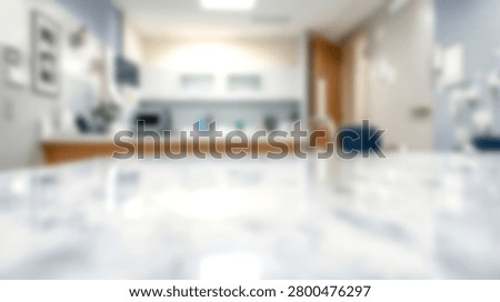 Clean reflective white table surface with blurred modern office kitchenette background