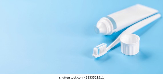 A clean and refreshing image featuring toothpaste and toothbrush, promoting oral hygiene and a bright smile. With copy space