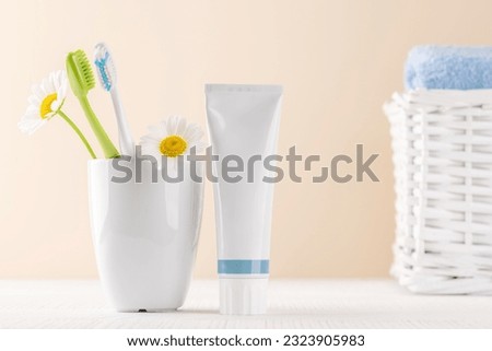 A clean and refreshing image featuring toothpaste and toothbrushes, promoting oral hygiene and a bright smile