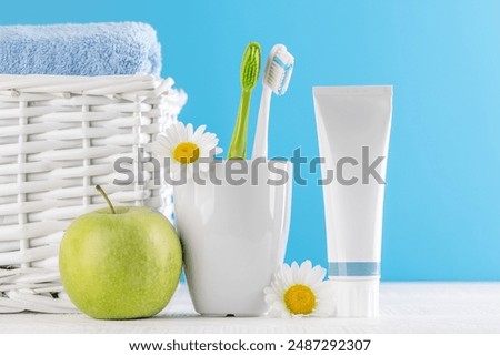 A clean and refreshing image featuring toothpaste and toothbrushes, promoting oral hygiene and a bright smile