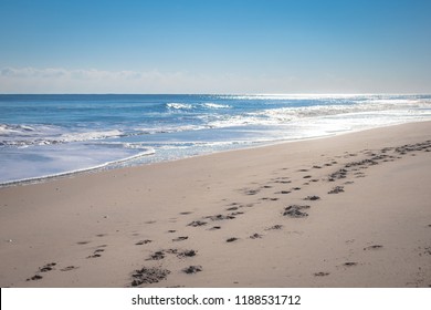 Clean Sand Beach Meet Clam Tropical Ocean With Small Waves And Some Of Foot Trail On Sand On Sunny Day In Summer - Ocean City, Maryland USA 