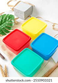 A clean and simple composition featuring plastic food containers, emphasizing their versatility for meal prep and food storage.