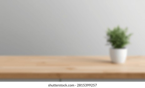A clean and simple interior scene featuring a small green potted plant on a light wooden table against a plain gray wall.