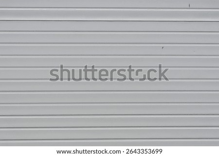 Clean and simple light grey horizontal metal siding provides a seamless texture background perfect for architectural designs and exterior wall projects