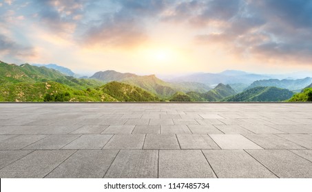 Clean square floor and mountain natural landscape at sunrise - Powered by Shutterstock