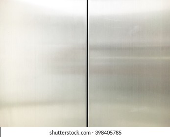 The clean stainless elevator doors.