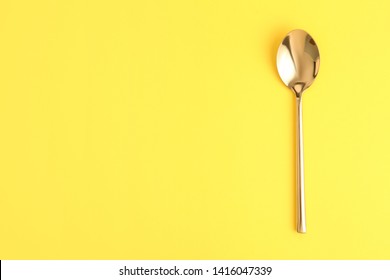 Clean Tea Spoon And Space For Text On Color Background, Top View
