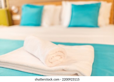 Clean Towels On Bed At Hotel Room. Clean Towels On Bed At Hotel Room. Towel In Hotel Room , Welcome Guests , Room Service.