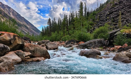 Clean Water Of A Mountain River In Siberia. Russia