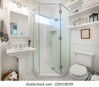 Clean White Bathroom With Subway Tile Glass Stand Up Shower And Pedestal Sink