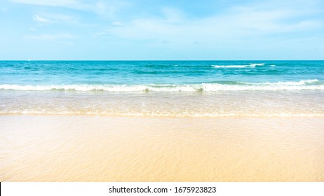 Clean white beach golden brown sand and small wave from blue sea under clear blue sky in a sunny day - Powered by Shutterstock