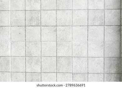Clean white ceramic tile texture background with square pattern. Minimal architectural surface for interior design, construction, and decoration concepts.