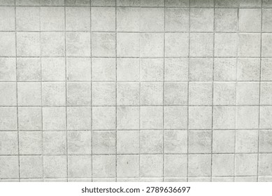 Clean white ceramic tile texture background with square pattern. Minimal architectural surface for interior design, construction, and decoration concepts.