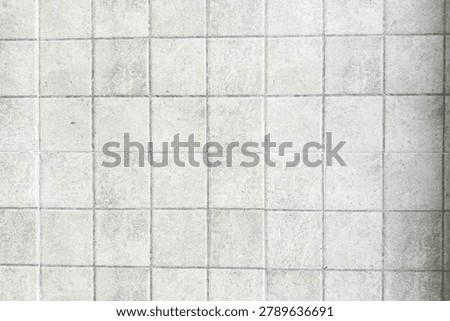 Clean white ceramic tile texture background with square pattern. Minimal architectural surface for interior design, construction, and decoration concepts.