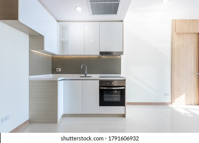 A Clean White Kitchen Corner In The Condo