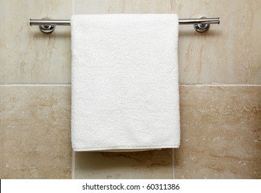 Clean white towel on a hanger - Powered by Shutterstock