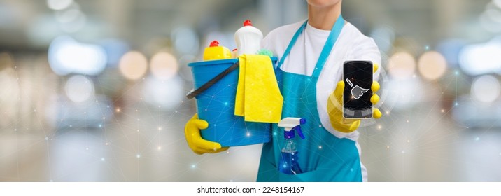 Cleaner showing app on virtual screen on blurred background. - Shutterstock ID 2248154167