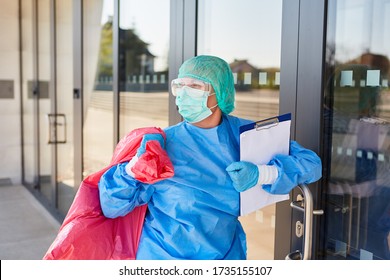 Cleaner When Checking Hazardous Waste Disposal In Clinic During Coronavirus Pandemic