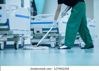 Cleaner,hospital Cleaning,cleaner With Mop And Uniform Cleaning Hall Floor,cleaning Floor With Mop In Patient Room,Cleaning The Hospital Floor