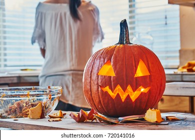 Cleaning Up After Making Jack O Lantern Pumpkin For Halloween On Kitchen Table