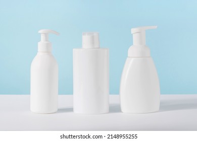 Cleaning Agent, Detergent And Liquid Soap Dispenser Bottle On Blue Background. Product Presentation Of Cleaning Products Mockup. Home Cleaning Supplies In Plastic Bottles Mock Up